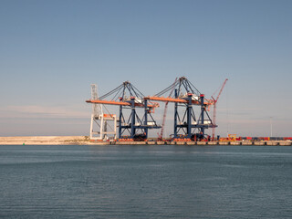 Rotterdam harbor big ship with containers and cranes on dock