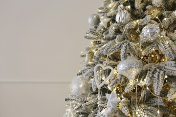 beautiful decorated Christmas tree with gifts under it in a luxury apartment decorated for the new year