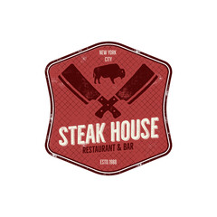 Steak House vintage Label. Typography letterpress design. steak house retro logo. Included bbq grill symbols for customizing steak house badge.Colorful insignia isolated