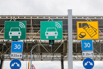 Traffic control sign in front of checkpoint gate .payments lines.toll road . WHSD Transponder Sign.traffic sign on highway toll ticket.Traffic jam at the point of payment for the road ,highway.