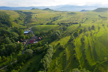 Flying over a village in Transylvania, Romania by drone