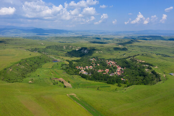 Flying over a village in Transylvania, Romania by drone