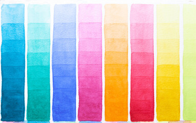 Palette of shades watercolors different colors painted on white paper.