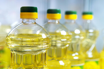 Plastic bottles with sunflower oil at the grocery store. Close-up
