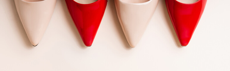 top view of leather heeled shoes on beige background, banner