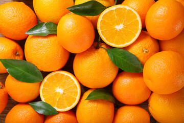 fresh orange fruits with leaves, top view
