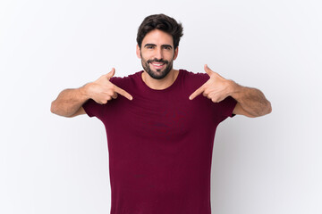 Young handsome man with beard over isolated white background proud and self-satisfied