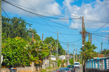 Narrow road in Guadeloupe country side on a cloudy day