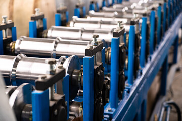 Worker at factory measures works metal production industrial