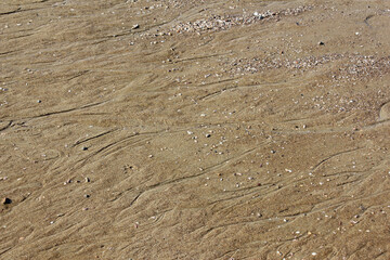 Texture water streak on sand the beach 