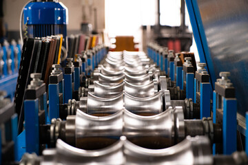 Worker at factory measures works metal production industrial