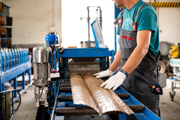 Worker at factory measures works metal production industrial