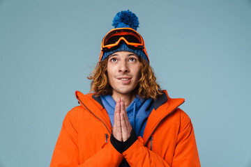 Caucasian tense sportsman posing with palms together