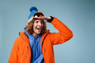 Caucasian excited sportsman posing and looking aside