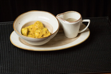 Fresh and hot dumplings with bouillon