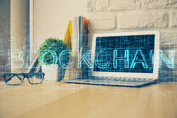 Double exposure of blockchain theme hologram and table with computer background. Concept of bitcoin...