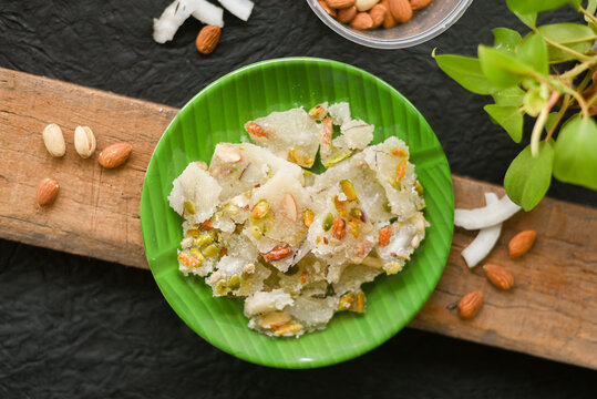 Petha Indian sweet sugar barfi or Burfi Diwali sweets Mithai , translucent soft dry fruits pista almond candy made from ash gourd , Delhi India. Kalakand
