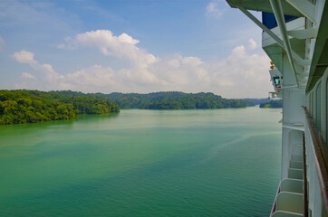 Modern Celebrity cruiseship or cruise ship liner on Chagres River during transit of Panama Canal...