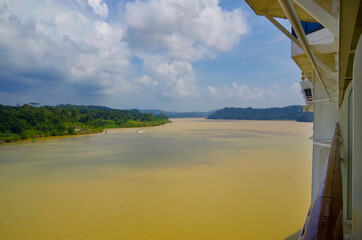 Modern Celebrity cruiseship or cruise ship liner on Chagres River during transit of Panama Canal...