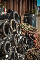 TRADITIONAL OCTOPUS WOODEN  FISHERMAN HOUSE WITH NETWORKS AND FISHING UTENSILS, IN SANTA LUZIA,...