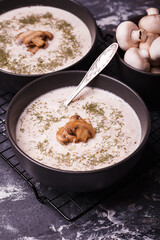 Mushroom soup. Soup with fresh mushrooms. Two plates of cream soup with vegetables