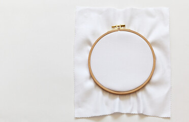 The white canvas is stretched into a quality comfortable wooden hoop for hand embroidery. Free...