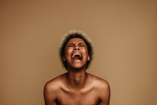 Portrait of african american female shouting in pain