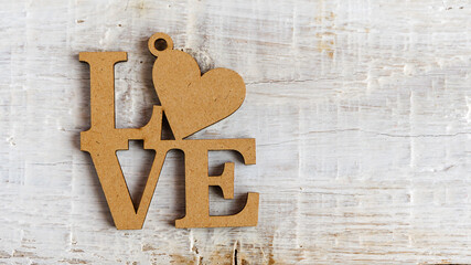 Wooden heart and text I love you on an old white background. Valentine's day