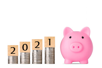 Business investment and saving growth year 2021 for advertising concept. Stacking coin growing with pink piggy bank on isolated white background studio, meaning of growing or saving or earning money