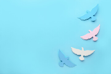 Paper doves on color background. International Day of Peace