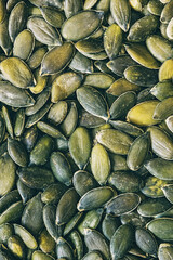 Close up on raw hulled pumpkin seeds