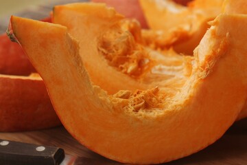 Fresh ripe pumpkin on a wooden table  