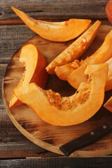 Fresh ripe pumpkin on a wooden table  