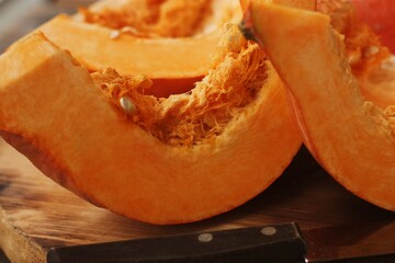 Fresh ripe pumpkin on a wooden table  