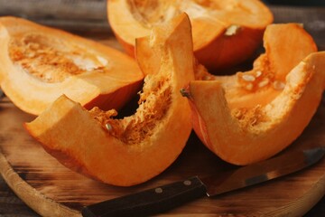 Fresh ripe pumpkin on a wooden table  