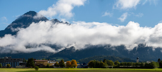 panorama of ferienregion reutte in autumn with clouds in front of mount thaneller