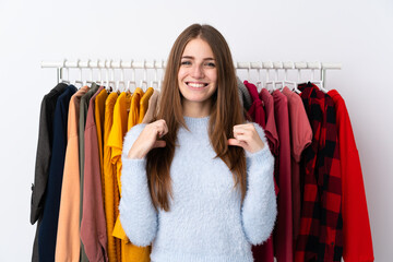 Young woman in a clothing store proud and self-satisfied