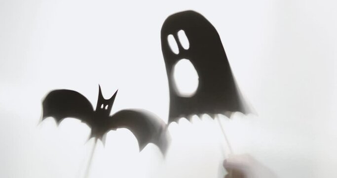 Halloween Decoration cardboard shadows puppets held by sticks ,  4k, cinematic, medium close-up, steady shot