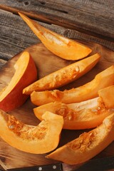Fresh ripe pumpkin on a wooden table  