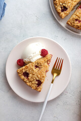 Raspberry and crumble pie. Fresh dessert fruit tart covered in raspberries.