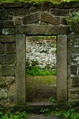 old stone wall with a door