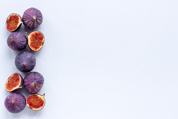 Pattern of whole and sliced figs. Overhead view