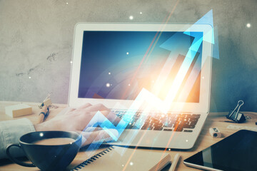 Growing arrows with businessman working on computer on background. Success concept. Double exposure.