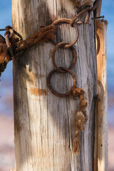 old wooden gate- Rusty chain
