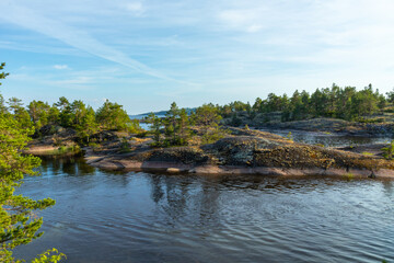 beautiful landscape with natural green plants and trees, rocks, mountain and pond, river in Karelia, Russia