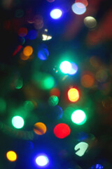 Colorful Christmas bokeh lights. Defocused Christmas background.