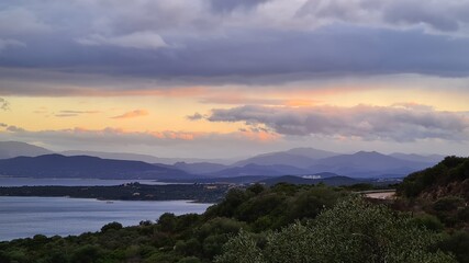 Fototapeta na wymiar Sunset over the coastal mountains of Costa Smeralda, Sardinia/Italy