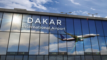 Airplane landing at Dakar Senegal airport mirrored in terminal - obrazy, fototapety, plakaty