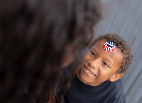 Cute African AMerican Boy Proudly Wearing I Voted Sticker