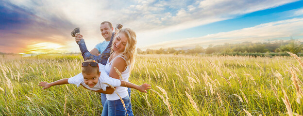 happy family in spikelet field. - Powered by Adobe